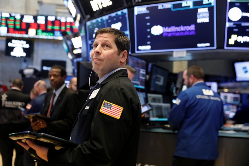 Traders work on the floor of the New York Stock Exchange shortly after the opening bell in New York