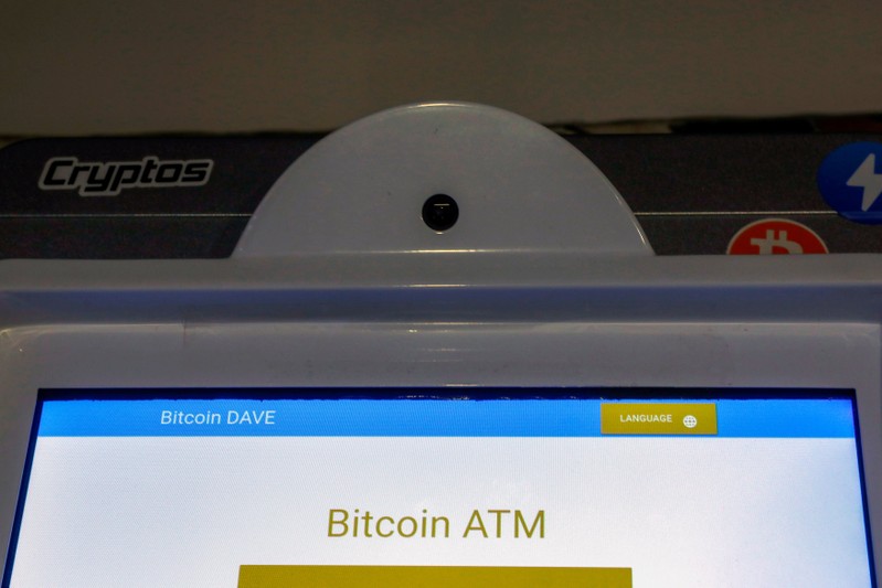 FILE PHOTO: A Bitcoin ATM is seen at the Bitcoin Center NYC in New York