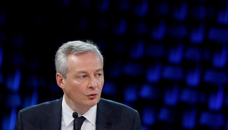 FILE PHOTO: French Finance Minister Bruno Le Maire delivers a speech as he attends a working session during the One Planet Summit at the Seine Musicale center in Boulogne-Billancourt, near Paris