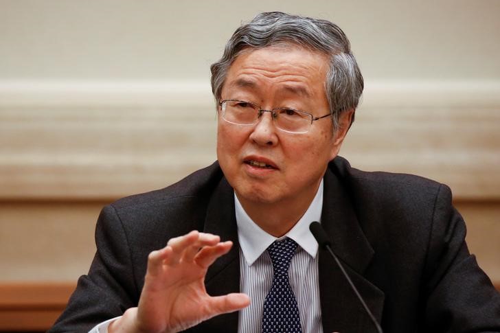 China's central bank governor Zhou Xiaochuan speaks during a session on the second day of the 19th National Congress of the Communist Party of China at the Great Hall of the People in Beijing