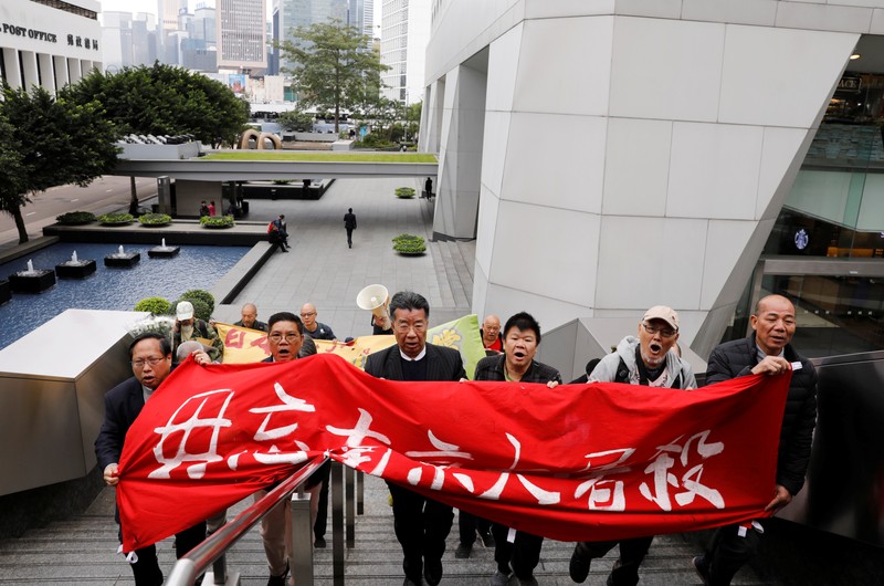 Protesters march to Japan's consulate to commemorate the 80th anniversary of the Nanjing Massacre, in Hong Kong