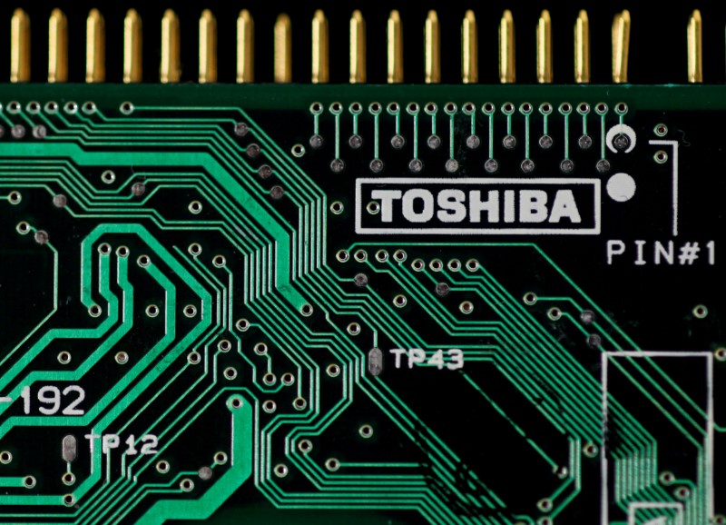 FILE PHOTO: A logo of Toshiba is seen on a printed circuit board in this photo illustration taken in Tokyo