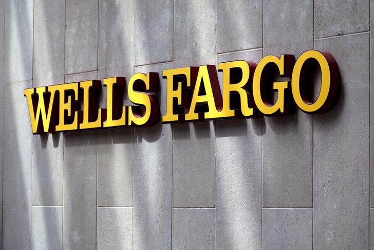 FILE PHOTO - The sign outside the Wells Fargo & Co. bank in downtown Denver
