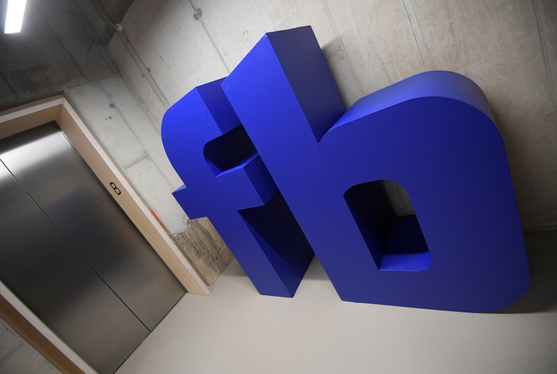 A giant logo is seen at Facebook's headquarters in London