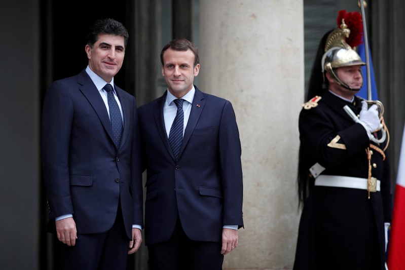 French President Emmanuel Macron welcomes Kurdish region's Prime Minister Nechirvan Barzani at the Elysee Palace in Paris