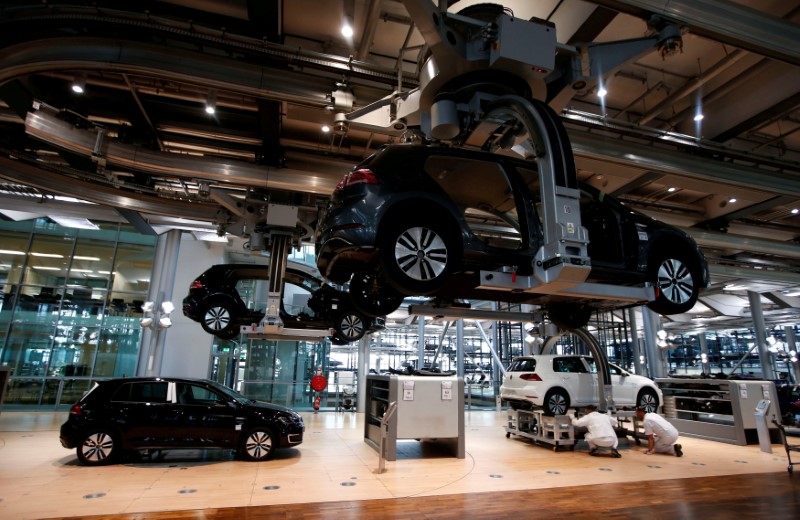FILE PHOTO: Workers assemble a VW e-Golf electric car in Dresden