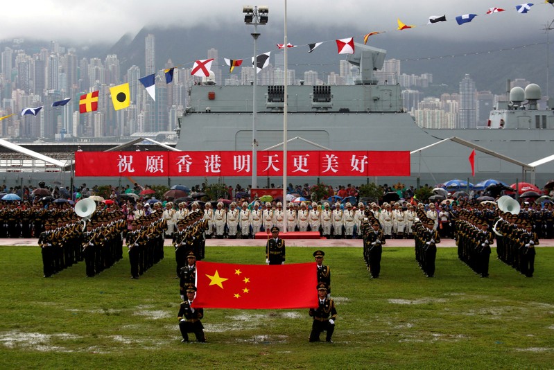 People's Liberation Army Navy soldiers take part in a parade in Hong Kong