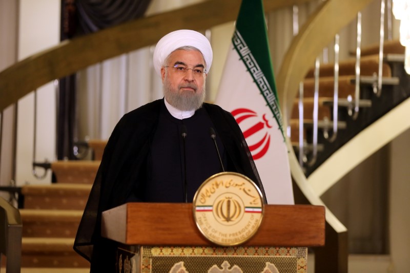 Iranian President Hassan Rouhani delivers a television address in Tehran