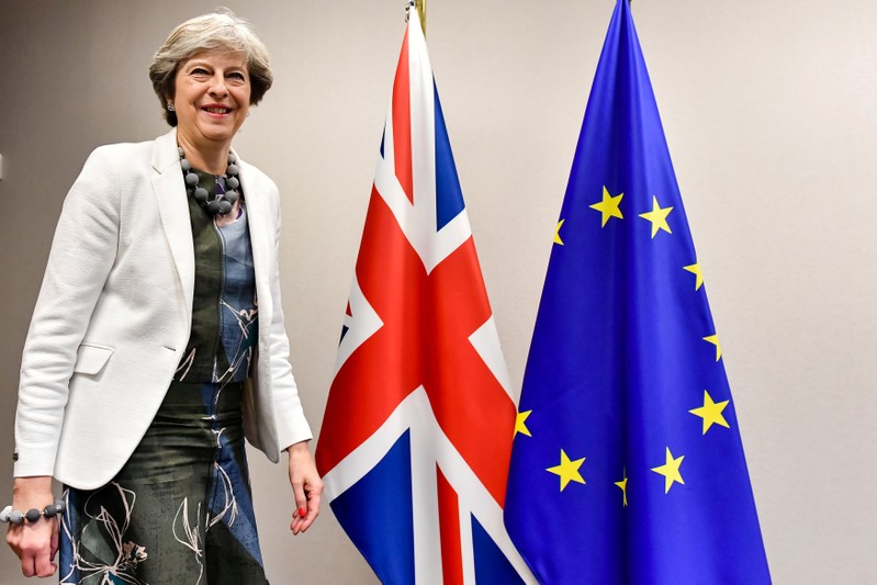 FILE PHOTO: Britain's Prime Minister Theresa May arrives for a meeting with European Council President Donald Tusk at a European Union leaders summit in Brussels