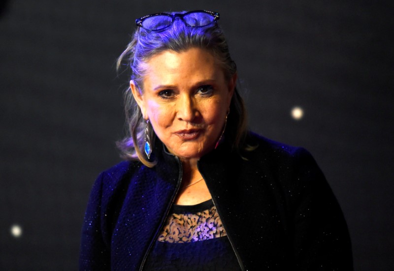 FILE PHOTO: Carrie Fisher poses for cameras as she arrives at the European Premiere of Star Wars, The Force Awakens in Leicester Square, London