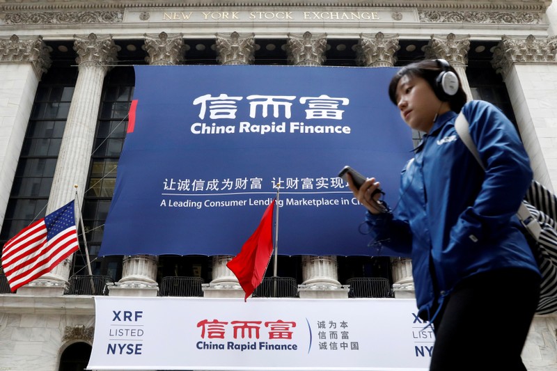 FILE PHOTO: A banner for China Rapid Finance Ltd. hangs on the facade of the NYSE to celebrate the company's IPO in New York
