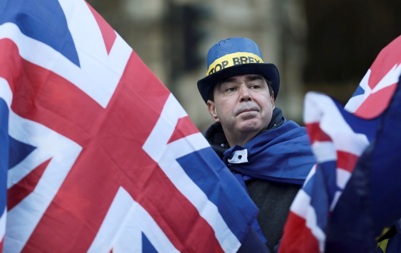 An anti-Brexit protester demonstrates outside the Houses of Parliament in London