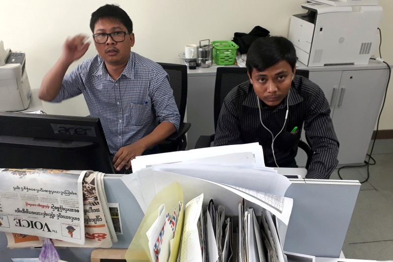 Reuters journalists Wa Lone and Kyaw Soe Oo pose for a picture at the Reuters office in Yangon, Myanmar