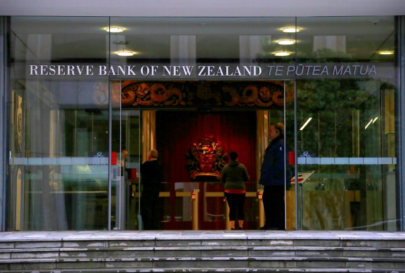 FILE PHOTO: A security guard stands in the main entrance to the Reserve Bank of New Zealand located in central Wellington, New Zealand