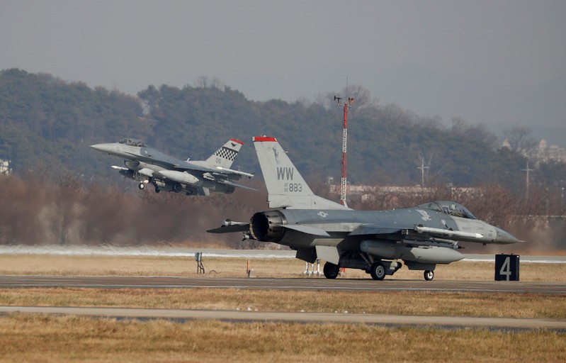 U.S. Air Force F-16 fighter jets take part in a joint aerial drill exercise called 'Vigilant Ace' between U.S. and South Korea, at the Osan Air Base in Pyeongtaek