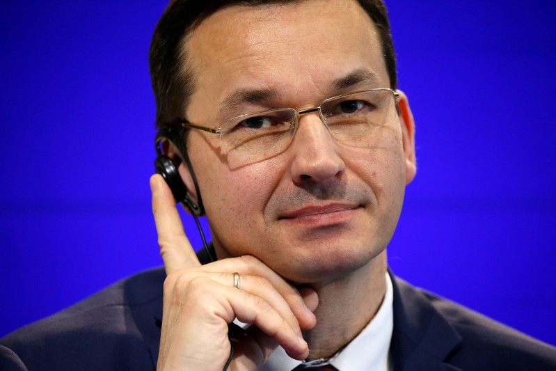 FILE PHOTO: Poland's Deputy Prime Minister and Finance Minister Mateusz Morawiecki attends a news conference at the Bercy Ministry in Paris