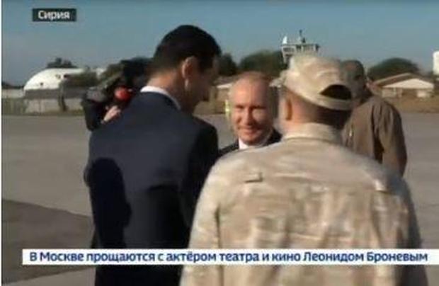 Putin flies into Syria, hugs Assad and declares victory