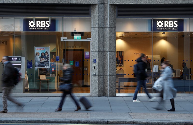 People walk past a branch of the Royal Bank of Scotland in London