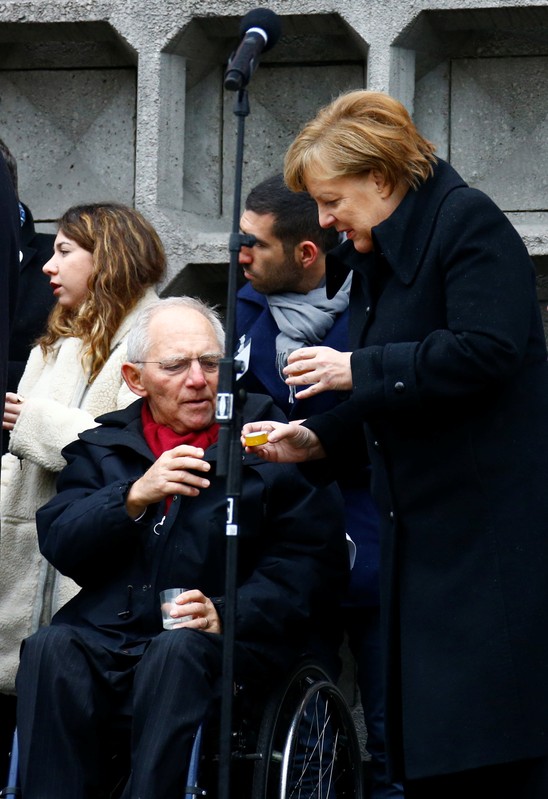 German Chancellor Merkel and Bundestag's President Schaeuble attend the inauguration of memorial at the site of last year's truck attack in a Christmas market at Breitscheidplatz square in Berlin