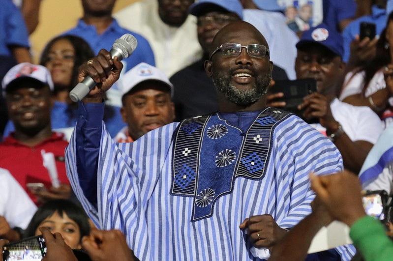 Weah, former soccer player and presidential candidate of Congress for Democratic Change (CDC), reacts while a speech during the party's presidential campaign rally at Samuel Kanyon Doe Sports Complex in Monrovia, Liberia