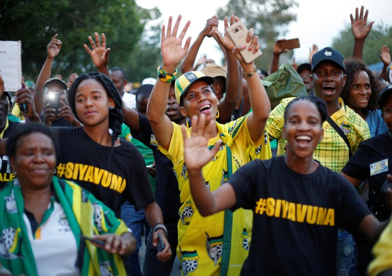 Supporters celebrate Cyril Ramaphosa being elected President of the ANC at the gates of the Nasrec Expo Centre in Johannesburg