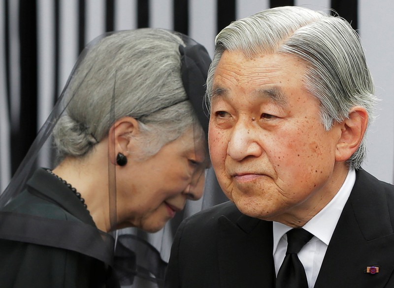 FILE PHOTO: Japan's Emperor Akihito and Empress Michiko leave after praying at the altar of late Prince Tomohito in Tokyo