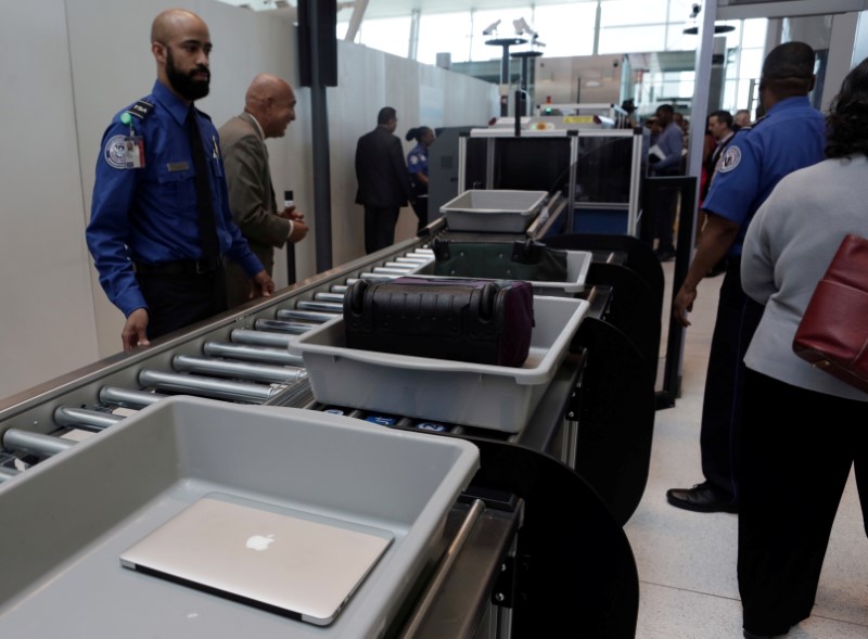 FILE PHOTO: Baggage and a laptop are scanned using the Transport Security Administration's new Automated Screening Lane technology at Terminal 4 of JFK airport in New York City