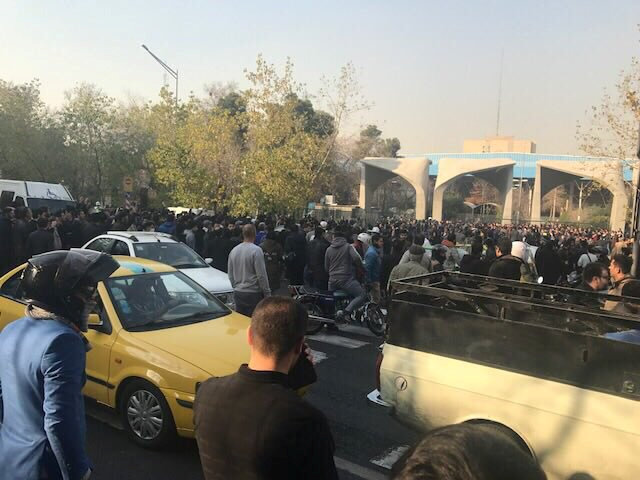 People protest near the university of Tehran