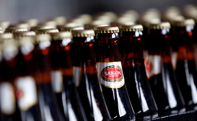 FILE PHOTO: Bottles of beer move along a production line at a factory of Saigon Beer Corporation (Sabeco) in Hanoi