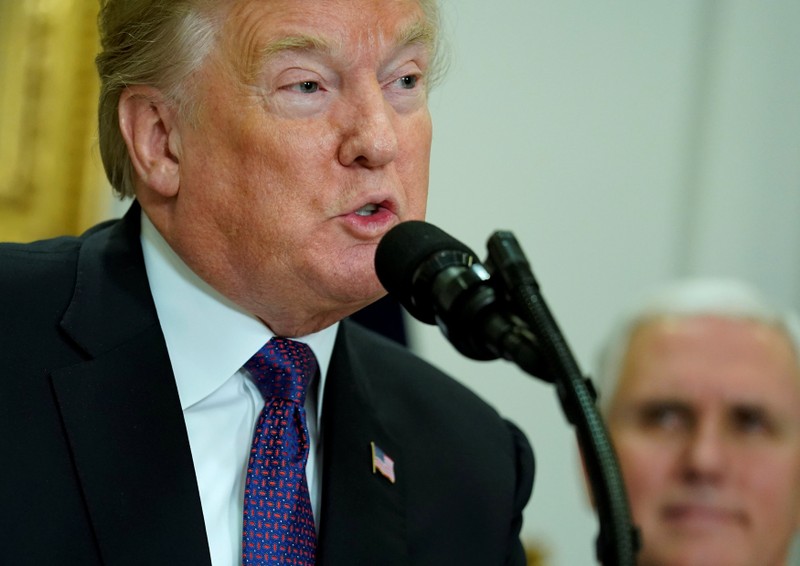 FILE PHOTO - U.S. President Donald Trump signs a proclamation for National Pearl Harbor Day at the White House in Washington.