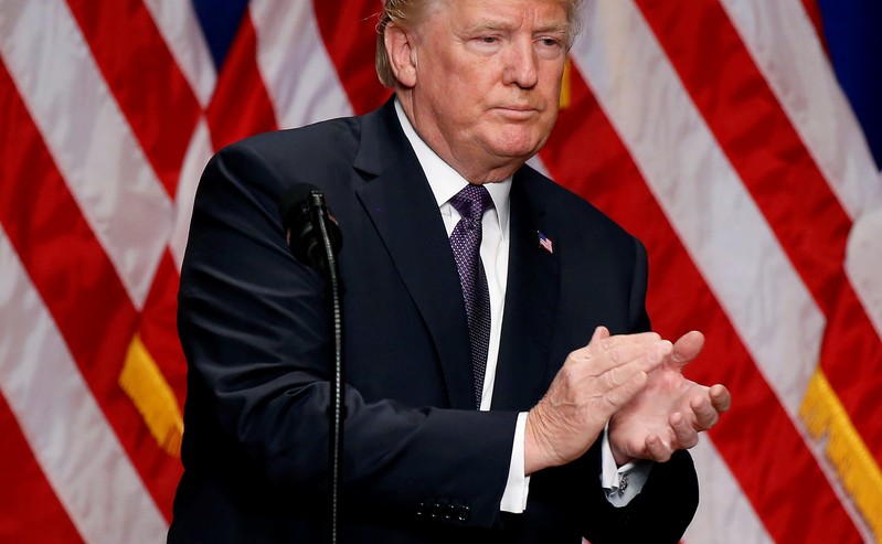 U.S. President Donald Trump claps after delivering remarks regarding the Administration's National Security Strategy at the Ronald Reagan Building and International Trade Center in Washington D.C