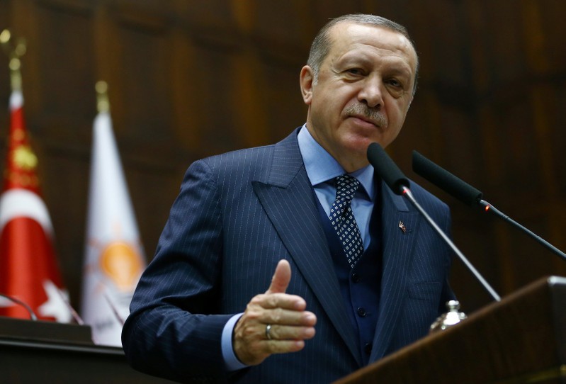 Turkish President Erdogan addresses members of parliament of his ruling AK Party during a meeting at the Parliament in Ankara