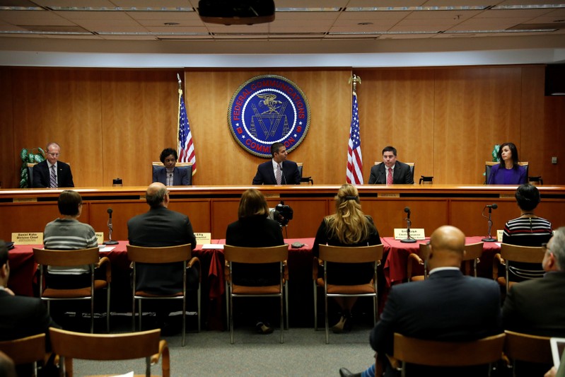 Chairman Ajit Pai leads a vote on the repeal of so called net neutrality rules at the Federal Communications Commission in Washington