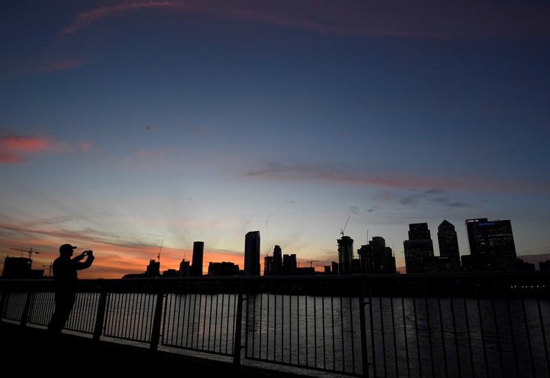 FILE PHOTO - The Canary Wharf financial district is seen at dusk in London