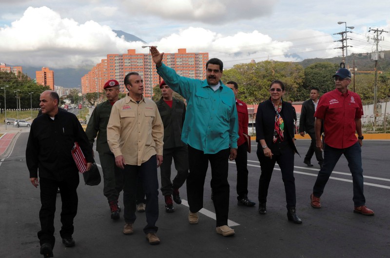 Venezuela's President Nicolas Maduro waves as he arrives for an event to hand over residences built under the government's housing programme in Caracas, Venezuela