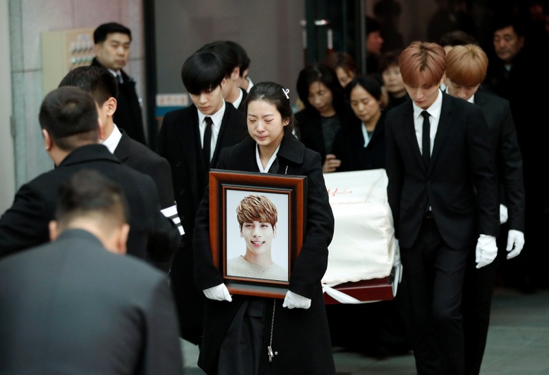 A portrait and the coffin of Kim Jong-hyun, the lead singer of top South Korean boy band SHINee, is carried during his funeral at a hospital in Seoul, South Korea