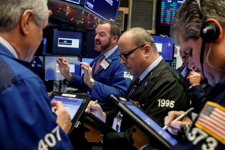 Wall Street lower as traders see past tax revamp