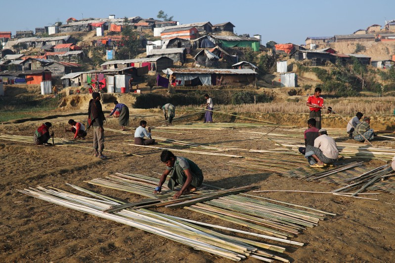 Rohingya refugees build shelter with bamboo at the Jamtoli camp in the morning in Cox's Bazar