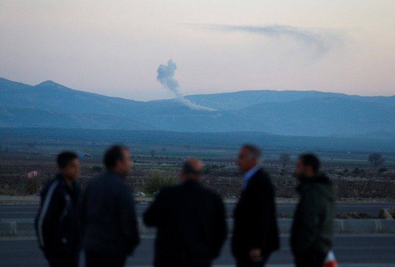 Smoke rises from the Syria's Afrin region, as it is pictured from near the Turkish town of Hassa, on the Turkish-Syrian border in Hatay province