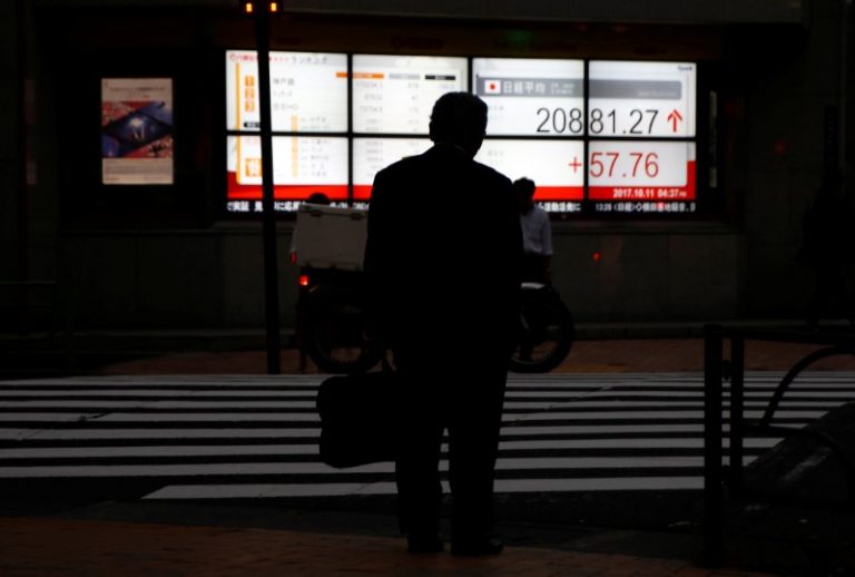 Asia stocks near record highs, U.S. funding woes weigh on dollar