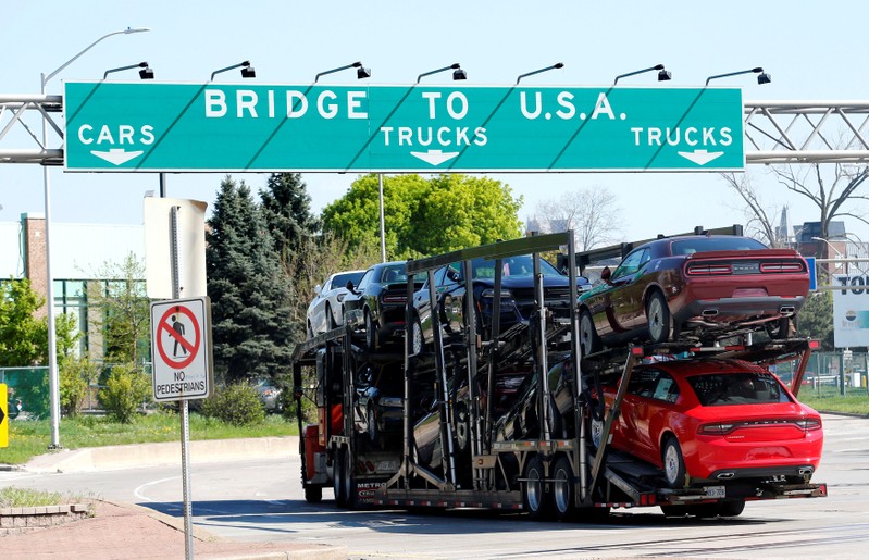 FILE PHOTO: A car hauler heading for Detroit, Michigan, drives on the lane to Ambassador Bridge in Windsor