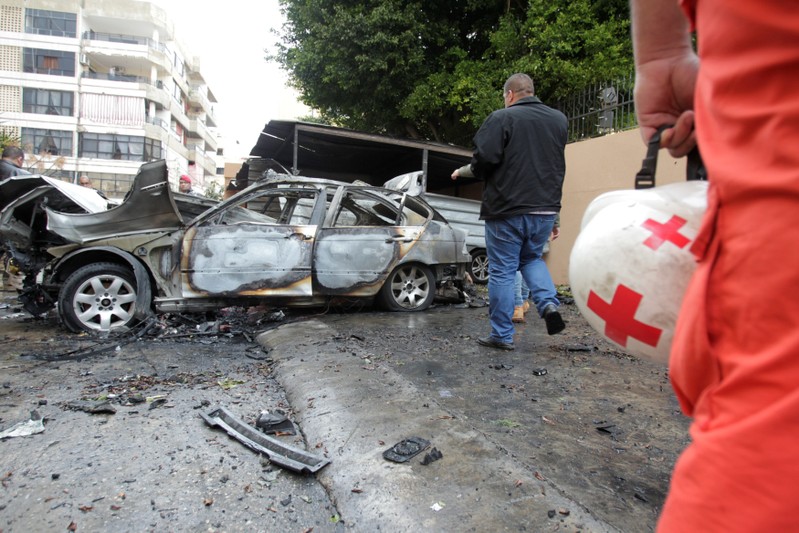 A damaged car is seen in Sidon