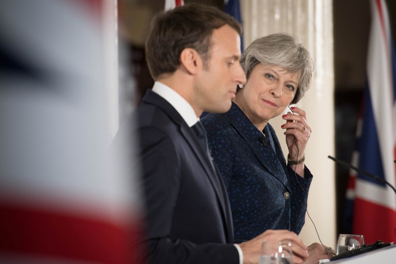 Britain's Prime Minister Theresa May and France's President Emmanuel Macron hold a news conference at the Royal Military Academy in Sandhurst