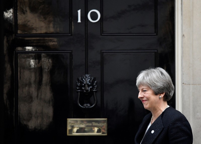 Britain's Prime Minister Theresa May walks out of 10 Downing Street to greet the Prime Minister of Estonia, Juri Ratas in London