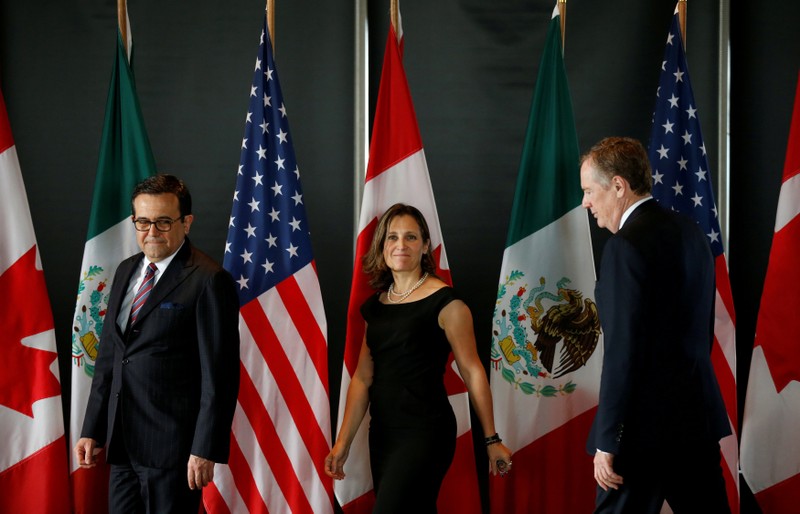FILE PHOTO: Mexico's Economy Minister Guajardo, Canada's Foreign Minister Freeland and U.S. Trade Representative Lighthizer arrive for a meeting during the third round of NAFTA talks in Ottawa