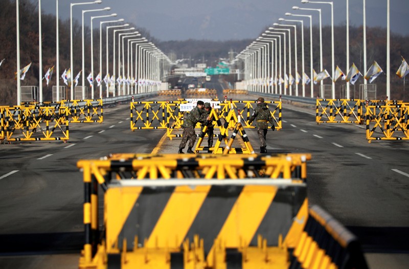 South Korean soldiers work on a barricade on the Grand Unification Bridge which leads to the truce village Panmunjom, just south of the demilitarized zone separating the two Koreas, in Paju
