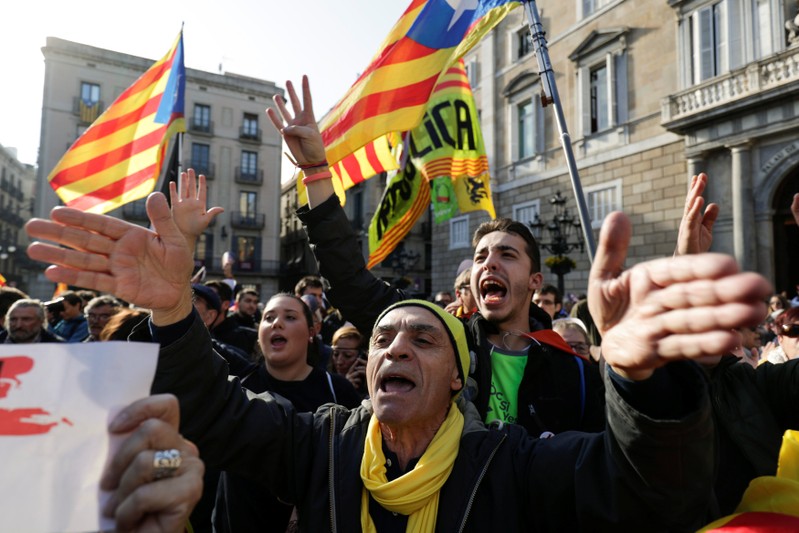 Pro-independence demonstrators shout slogans during a protest in Barcelona