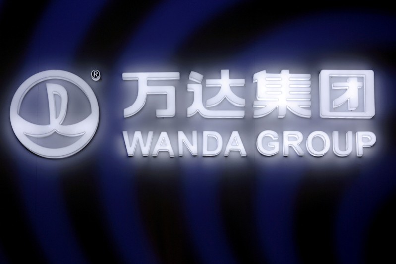 FILE PHOTO: A sign of Dalian Wanda Group in China glows during an event announcing strategic partnership between Wanda Group and FIFA in Beijing