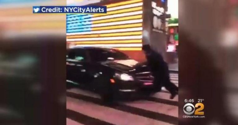 Driver who hit cop in Times Square remains at large