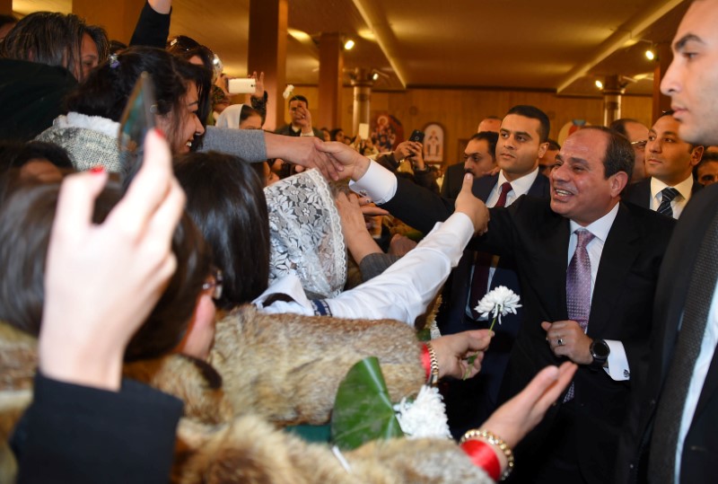 Egyptian President Abdel Fattah al-Sisi greets faithful at the new Coptic Cathedral 